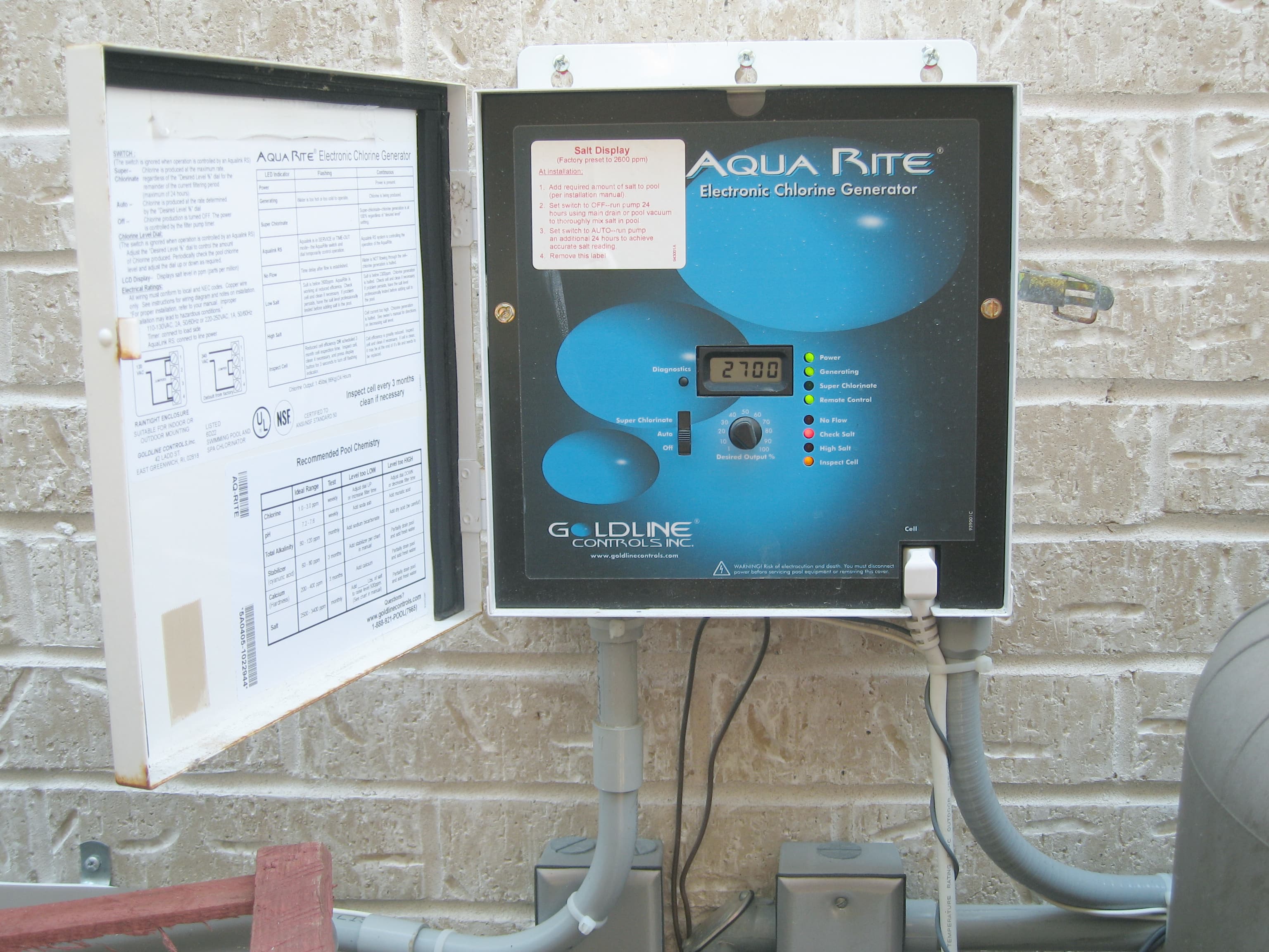 Salt chlorine generator control box at a pool equipment pad
